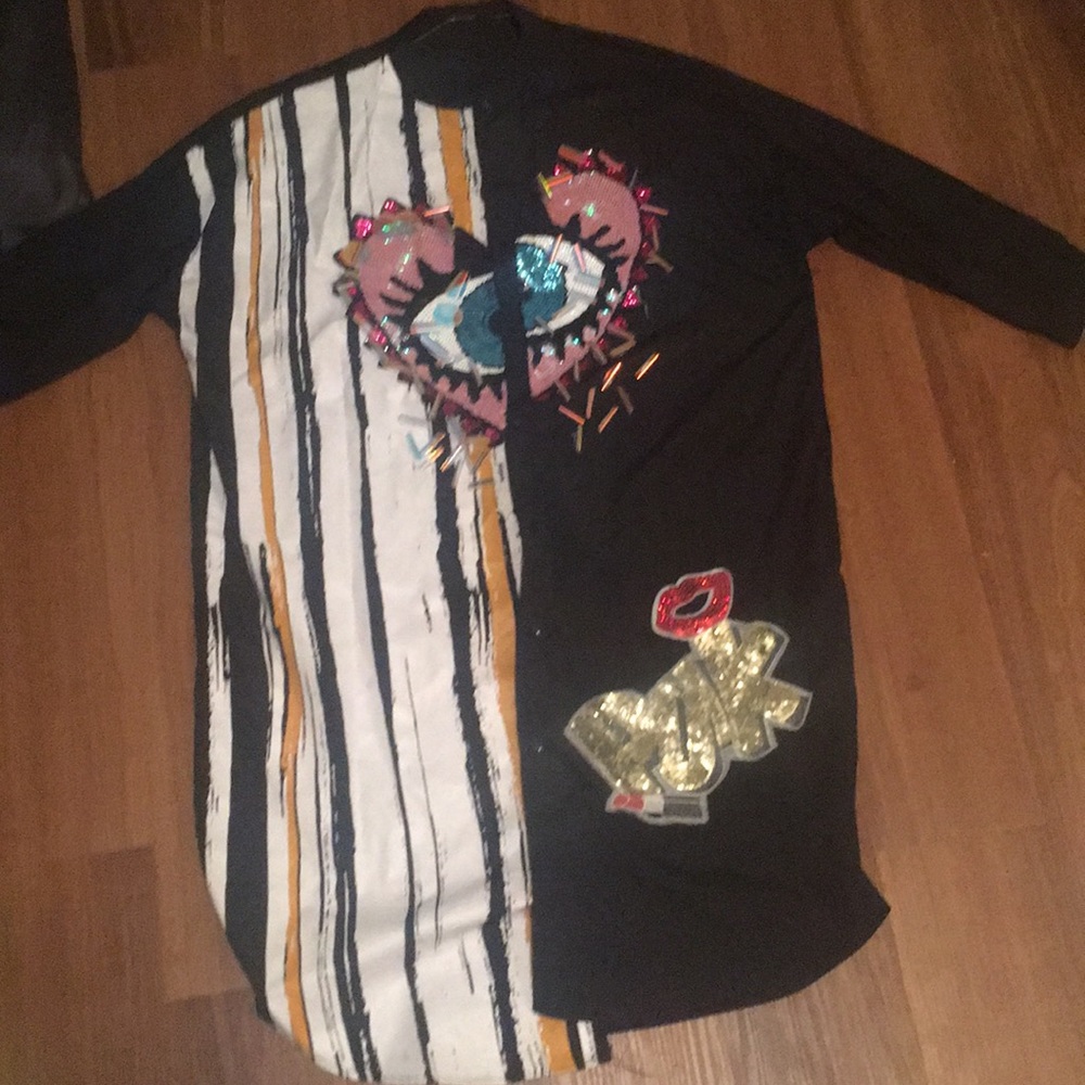 Black Shirt dress with sequence designs on it.
